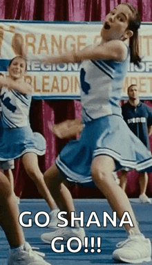 a group of cheerleaders are dancing in front of a banner that says go shana go !!!