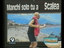 a man is dancing in front of a sign that says " scala "