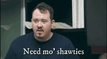 a man says need mo shawties in front of a bookshelf