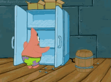 patrick star from spongebob squarepants is opening a refrigerator filled with ice .