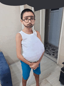 a boy wearing glasses and a white tank top has a fake mustache on his face