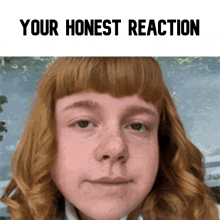 a picture of a girl with red hair and the words " your honest reaction " on the bottom