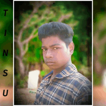 a young man in a plaid shirt poses for a picture with the letters t n s u behind him