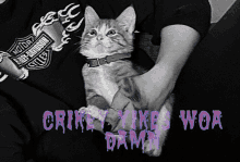 a black and white photo of a person holding a cat with the words crikey vikes woa damn on the bottom