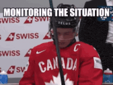 a hockey player wearing a red canada jersey