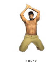 a shirtless man in khaki pants is jumping in the air with his hands in the air .