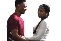 a man and a woman are holding hands and smiling