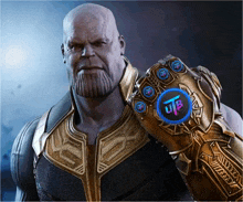 thanos is wearing a glove that says ultb on it