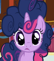 a purple and pink pony with a swirl in her mane