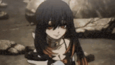 a girl with long black hair is sitting on a rock in a cave .