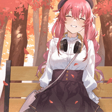 a girl with pink hair and headphones sits on a bench with her eyes closed