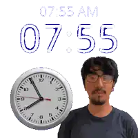 a man stands in front of a clock that says 7:55 am