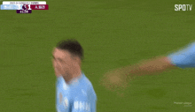 a blurry picture of a soccer player on a field with the words spotv on the bottom right