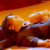 a couple of people laying on the floor with the name pabeyork visible in the corner