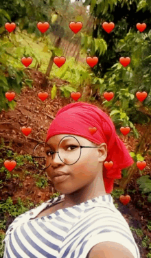 a woman wearing glasses and a red head scarf has hearts around her head