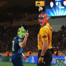 a soccer player wearing a number 11 jersey stands next to a referee