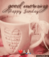 a good morning happy sunday greeting card with a cup of coffee .