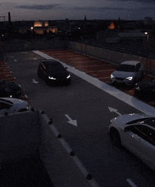 cars are parked in a parking garage with arrows pointing to the right