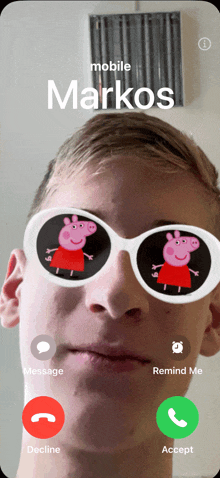 a man wearing a pair of peppa pig sunglasses is on a call with markos