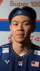 a man wearing a headband that says super 100 plus