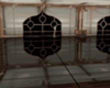 a blurred image of a room with a clock on the wall and a clock hanging from the ceiling .