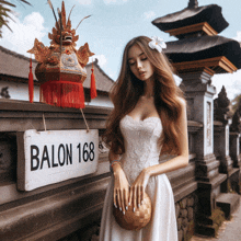 a woman standing in front of a sign that says balon 168