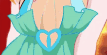 a close up of a cartoon character wearing a green dress with a heart on the collar .