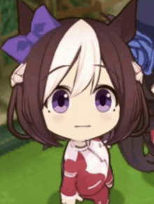 a close up of a cartoon character with purple eyes and a purple bow .