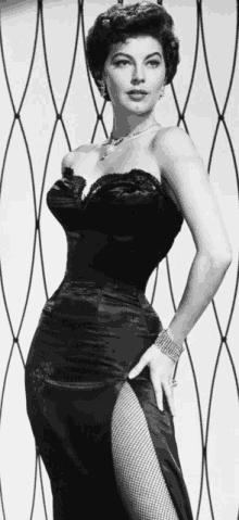 a black and white photo of a woman in a corset