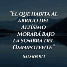 a bible verse in spanish with a picture of mountains and a lake .