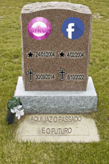 a gravestone with facebook and orkut logos on it