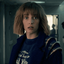 a girl wearing a shirt that says team meup