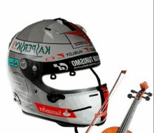 a helmet with a violin next to it that says om2rut