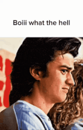 a close up of a man 's face with the words boiii what the hell above him