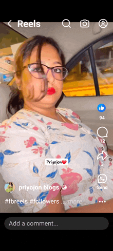 a woman wearing glasses is sitting in a car with the word reels on the bottom