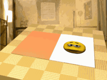 a picture of a smiley face on a checkered table cloth