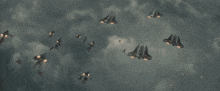 a group of fighter jets flying in the sky