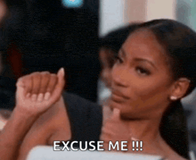 a woman is giving a thumbs up with the words excuse me !!! below her