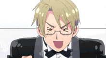 a man in a tuxedo and bow tie is making a face .