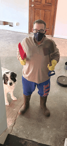 a man wearing a mask is holding a shovel and a red spatula