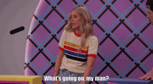 a woman says what 's going on my man in front of a purple background