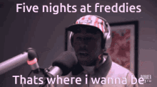 a man singing into a microphone with the words five nights at freddies that 's where i wanna be