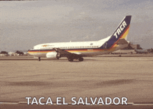 a taca el salvador airplane is sitting on the runway