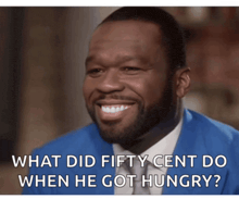 a man in a blue suit and tie is smiling and says what did fifty cent do when he got hungry