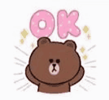 a brown bear with a pink balloon that says ok .