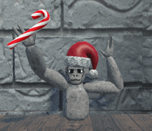 a monkey wearing a santa hat holds a candy cane