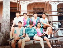 a group of young men are posing for a picture with myheritage in the upper right corner