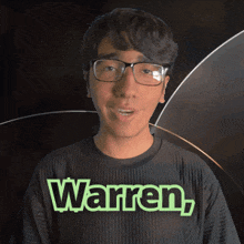 a man wearing glasses and a black shirt with the name warren on it