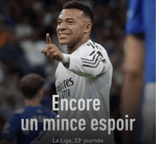 a poster of a soccer player with the words " encore un mince espoir " on it