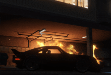 a car is on fire in a garage with a light hanging from the ceiling